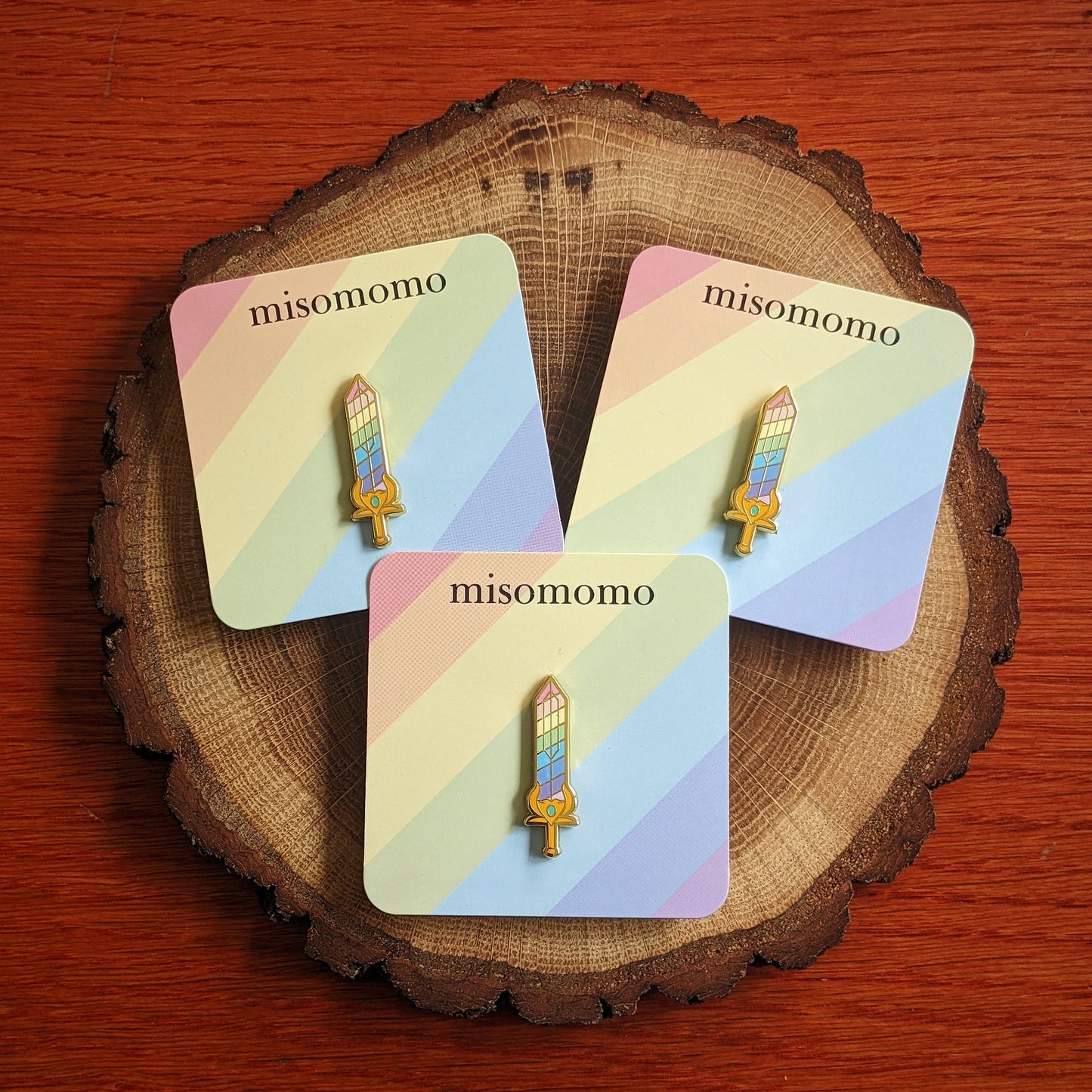 Rainbow Sword Pin on Backing Cards with "misomomo" text
