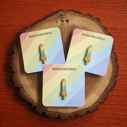 Rainbow Sword Pin on Backing Cards with "misomomo" text
