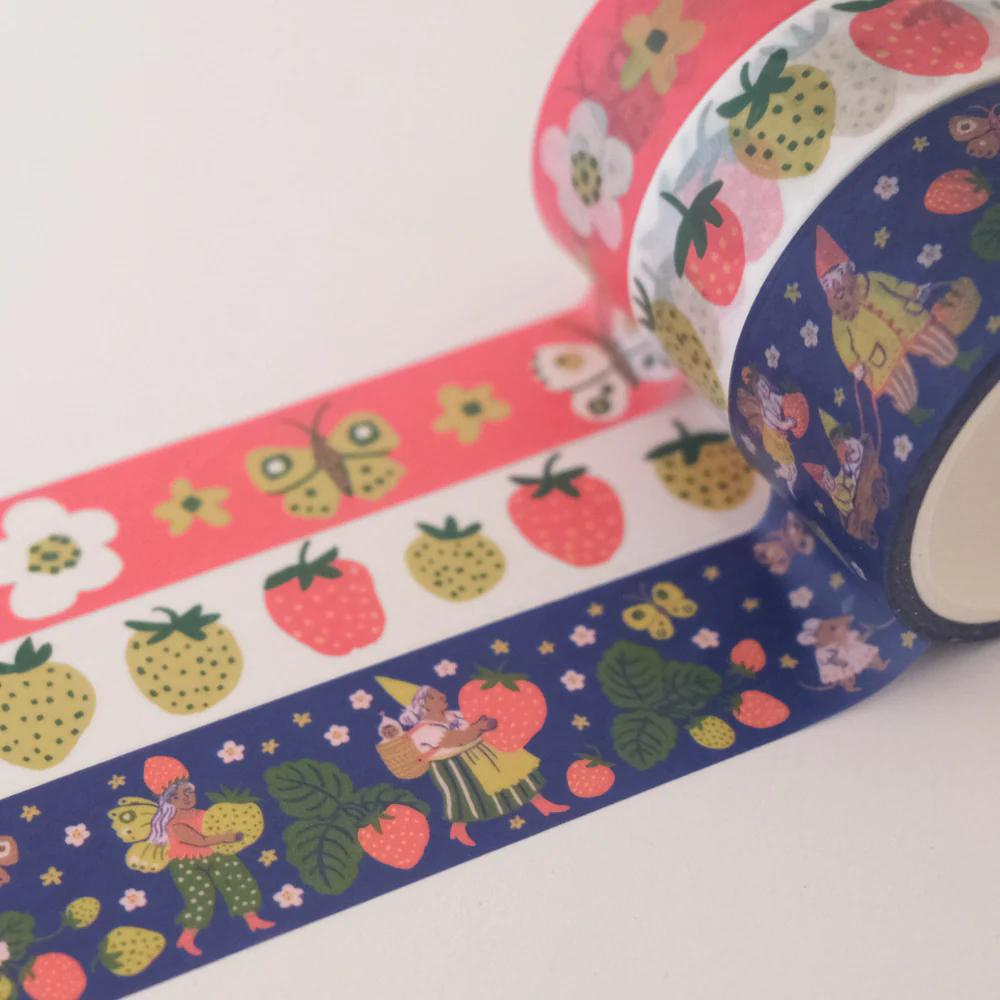 roll of washi tapes with butterflies, flowers, strawberries, and gnome print on it