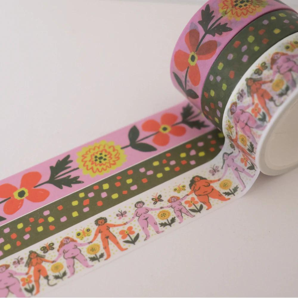 washi tape roll with marigold, dots, and female body print on it