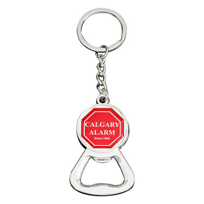 A keychain bottle opener featuring a red and white logo, perfect for effortlessly opening bottles on the go- yourstuffmade