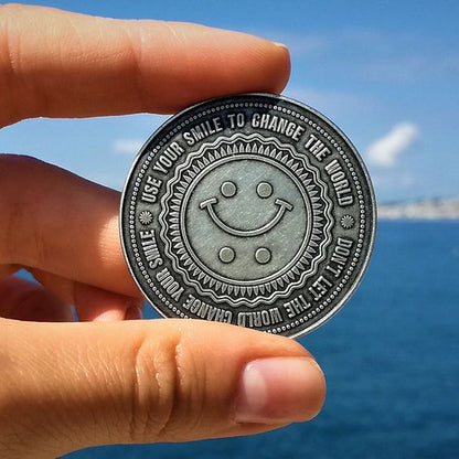 Silver Happy/Sad Coin with "USE YOUR SMILE TO CHANGE THE WORLD"