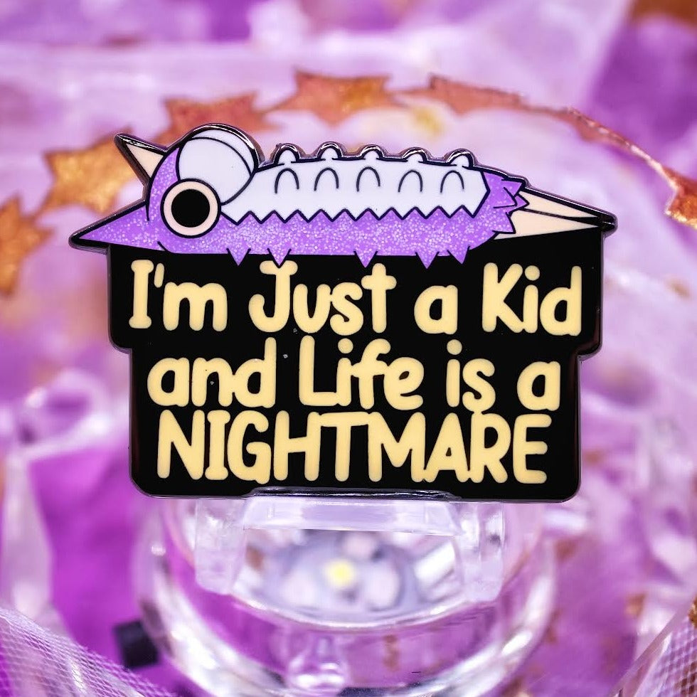 Violet Wurmple Enamel Pin with "I'm Just a Kid and Life is a NIGHTMARE" text