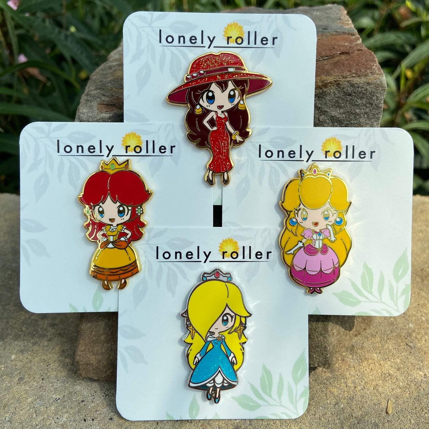 Super Mario Princesses Hard Enamel Pin on Backing Card with "lonely roller" text