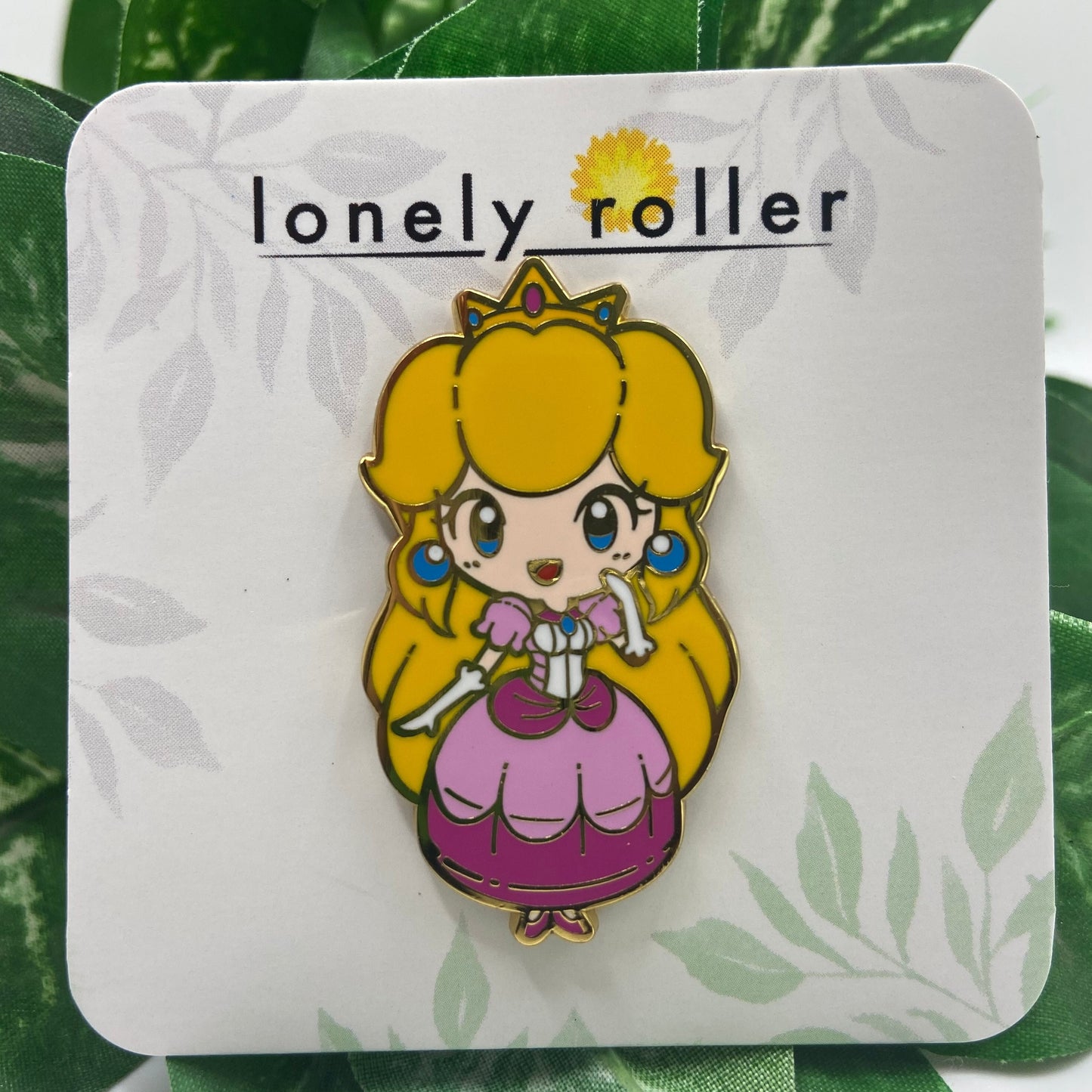Super Mario Princess Peach Enamel Pin on Backing Card with "lonely roller" text